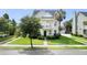 Charming two-story home with a welcoming front porch, neat lawn, and beautiful landscaping at 123 Gaslight Blvd, Summerville, SC 29483