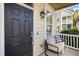 Charming front porch with a comfortable seating area, decorative pillows, and a tranquil ambiance at 123 Gaslight Blvd, Summerville, SC 29483
