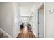 Hallway with a view to the living room and a bar countertop with stools at 123 Gaslight Blvd, Summerville, SC 29483
