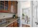 Modern kitchen featuring granite countertops, stainless steel appliances and brown cabinets at 123 Gaslight Blvd, Summerville, SC 29483
