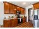 Spacious kitchen boasts stainless steel appliances, brown cabinets, and ample countertop space at 123 Gaslight Blvd, Summerville, SC 29483
