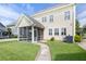 Back of house with screened in porch and manicured backyard at 123 Gaslight Blvd, Summerville, SC 29483