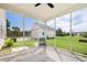 View from screened porch looking out at detached garage and landscaped yard at 123 Gaslight Blvd, Summerville, SC 29483
