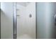 Shower with frosted glass door, shower head, and built in shelf at 123 Gaslight Blvd, Summerville, SC 29483