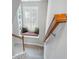 Staircase with a built in bench, storage shelves and window at 123 Gaslight Blvd, Summerville, SC 29483