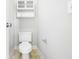 Toilet with cabinet above and a toilet paper holder on the wall at 123 Gaslight Blvd, Summerville, SC 29483