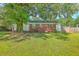 Expansive backyard with lush green grass and mature trees providing ample shade and privacy at 131 Harvey Ave, Goose Creek, SC 29445