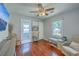 Comfortable bedroom with hardwood floors, ceiling fan, and sitting area at 131 Harvey Ave, Goose Creek, SC 29445