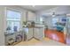 Bright kitchen with views to living space and gray cabinetry at 131 Harvey Ave, Goose Creek, SC 29445