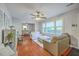 Bright living room with hardwood floors, neutral paint, ceiling fan and plenty of natural light at 131 Harvey Ave, Goose Creek, SC 29445