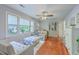 Inviting living room with hardwood floors, a ceiling fan, and large windows offering abundant natural light at 131 Harvey Ave, Goose Creek, SC 29445