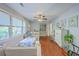 Comfortable living room with hardwood floors, stylish decor, and a view to the deck and green outdoors at 131 Harvey Ave, Goose Creek, SC 29445