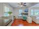 Bright office space with hardwood floors, a ceiling fan, and modern desk setup at 131 Harvey Ave, Goose Creek, SC 29445