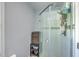 Modern walk-in shower with glass door, white tiles, and adjustable shower head at 131 Harvey Ave, Goose Creek, SC 29445