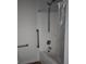 Accessible bathtub and shower with grab bars, shower head, and white acrylic walls at 1346 Ellison Run, Charleston, SC 29412