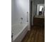Bathroom featuring a soaking tub, vanity with sink and white walls at 1346 Ellison Run, Charleston, SC 29412