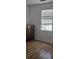 Bedroom featuring hard wood floors and a dresser under a window at 1346 Ellison Run, Charleston, SC 29412