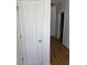 Hallway with a closet, hardwood floors, and white painted walls at 1346 Ellison Run, Charleston, SC 29412