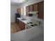 Functional kitchen equipped with stainless steel appliances, white countertops, and wood cabinetry at 1346 Ellison Run, Charleston, SC 29412