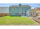 Spacious backyard with patio, outdoor kitchen, and pergola-covered seating area at 139 Back Tee Cir, Summerville, SC 29485