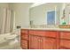 Bathroom featuring granite countertops, wood cabinets, a shower/tub combo, and tile floors at 139 Back Tee Cir, Summerville, SC 29485