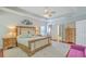 Bright, spacious bedroom with tray ceiling, wood floors, area rug, and charming wood furniture at 139 Back Tee Cir, Summerville, SC 29485
