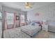 Charming bedroom with a pink theme, natural light and colorful rug at 139 Back Tee Cir, Summerville, SC 29485