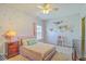 Bedroom with accent wall, ceiling fan, area rug, and side table with table lamp at 139 Back Tee Cir, Summerville, SC 29485