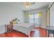 Comfortable bedroom featuring a queen bed, hardwood floors, and natural light at 139 Back Tee Cir, Summerville, SC 29485