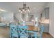Bright, open-concept dining area with modern chandelier adjacent to the living room and kitchen at 139 Back Tee Cir, Summerville, SC 29485