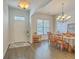 Inviting dining room with wood floors, chandelier, and front door access, perfect for gatherings at 139 Back Tee Cir, Summerville, SC 29485