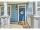 Charming entryway with a blue front door, white trim, and a decorative welcome sign at 139 Back Tee Cir, Summerville, SC 29485