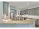 Stylish kitchen featuring stainless steel appliances, granite countertops, and light gray cabinetry at 139 Back Tee Cir, Summerville, SC 29485