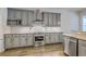 Updated kitchen with stainless steel appliances, granite countertops, and white subway tile backsplash at 139 Back Tee Cir, Summerville, SC 29485