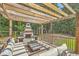 Outdoor entertainment area features an inviting fireplace and ample seating at 139 Back Tee Cir, Summerville, SC 29485