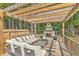 Outdoor entertainment area features an inviting fireplace and ample seating at 139 Back Tee Cir, Summerville, SC 29485