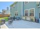 Inviting patio with outdoor kitchen, seating area and lush backyard views at 139 Back Tee Cir, Summerville, SC 29485