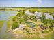 Beautiful coastal neighborhood with houses nestled among lush trees, pond, and waterway access at 1621 Folly Creek Way # D-8, Charleston, SC 29412