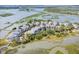 Drone shot capturing a beautiful coastal community with marsh views and elevated homes and bridge at 1621 Folly Creek Way # D-8, Charleston, SC 29412
