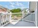 Charming balcony view featuring surrounding neighborhood and white railing at 1621 Folly Creek Way # D-8, Charleston, SC 29412