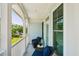 Relaxing covered balcony with blue patio furniture, perfect for enjoying outdoors at 1621 Folly Creek Way # D-8, Charleston, SC 29412