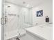 Beautiful bathroom with a frameless glass shower, marble tile, modern fixtures, and coastal-themed decor at 1621 Folly Creek Way # D-8, Charleston, SC 29412