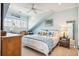 Cozy bedroom with slanted ceilings, a ceiling fan, a windowed desk area, and ample natural light at 1621 Folly Creek Way # D-8, Charleston, SC 29412