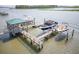 Picturesque aerial view of a private boat dock with multiple lifts in a coastal setting at 1621 Folly Creek Way # D-8, Charleston, SC 29412