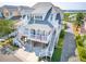 Lovely coastal home on stilts with dual balconies, showcasing classic design and serene neighborhood setting at 1621 Folly Creek Way # D-8, Charleston, SC 29412