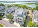 Beautiful two-story coastal home featuring white railings, gray shingles, and elevated design for stunning curb appeal at 1621 Folly Creek Way # D-8, Charleston, SC 29412