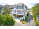 Charming coastal home with elevated structure, white railings, and multiple covered porches, perfect for waterfront living at 1621 Folly Creek Way # D-8, Charleston, SC 29412