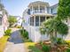Inviting coastal home showcasing multi-level balconies, screened porch and palm trees at 1621 Folly Creek Way # D-8, Charleston, SC 29412