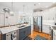 Bright kitchen featuring an island with barstool seating, stainless steel appliances, and a seamless connection to the dining area at 1621 Folly Creek Way # D-8, Charleston, SC 29412