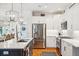 Modern kitchen featuring stainless steel appliances, white cabinets, and an island with a sink and breakfast bar seating at 1621 Folly Creek Way # D-8, Charleston, SC 29412